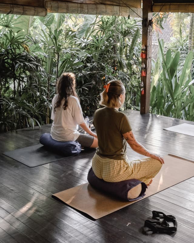 Ashtanga yoga practice in Bali open-air pavilion